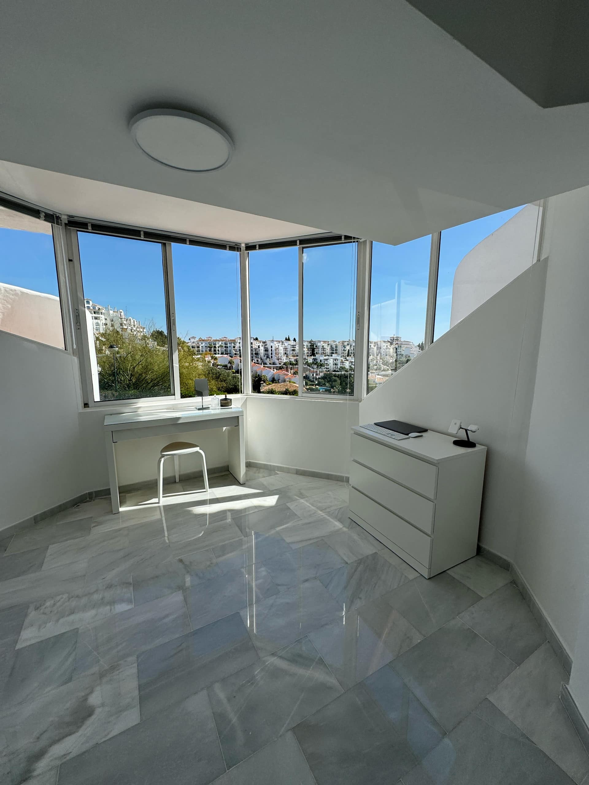 Apartment interior with marble floors at La Casa Neil, Calahonda